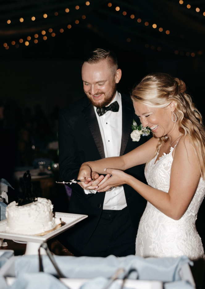 bride and groom cutting cake